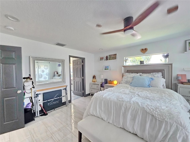 7935 NW 90th Ct, Okeechobee, FL 34972 - bedroom with ceiling fan and a textured ceiling