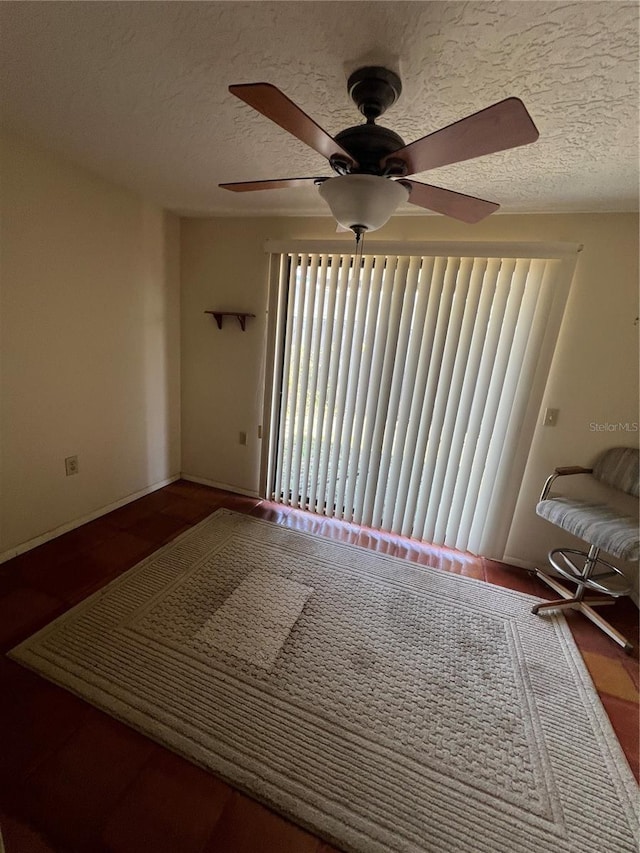 1096 8th St, Okeechobee, FL 34974 - spare room with a textured ceiling and ceiling fan