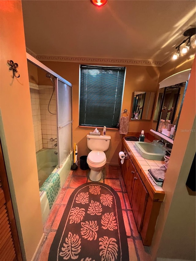 1096 8th St, Okeechobee, FL 34974 - full bathroom featuring toilet, vanity, bath / shower combo with glass door, and crown molding