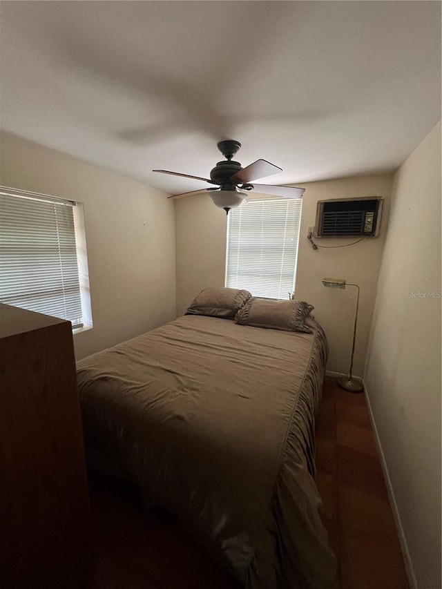1096 8th St, Okeechobee, FL 34974 - bedroom with baseboards, a wall mounted air conditioner, and a ceiling fan