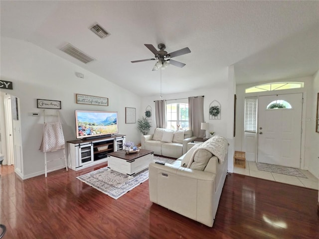 3897 NW 22nd Ave, Okeechobee, FL 34972 - living area featuring vaulted ceiling, wood finished floors, ceiling fan, and baseboards
