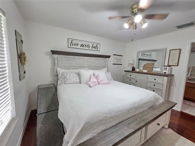 3897 NW 22nd Ave, Okeechobee, FL 34972 - bedroom featuring dark wood-type flooring, connected bathroom, baseboards, and a ceiling fan