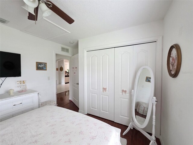 3897 NW 22nd Ave, Okeechobee, FL 34972 - bedroom featuring dark wood-style flooring, a closet, a ceiling fan, and arched walkways