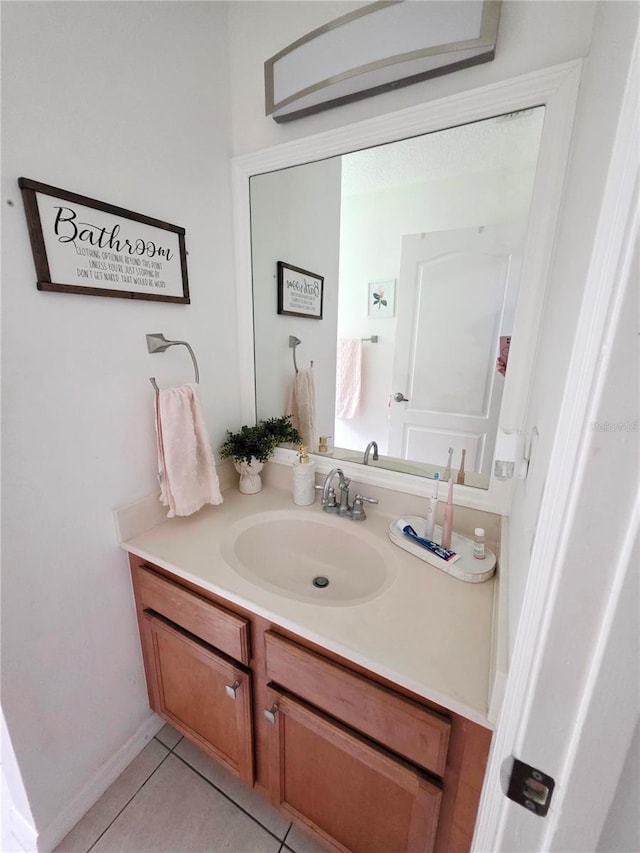 3897 NW 22nd Ave, Okeechobee, FL 34972 - bathroom featuring vanity and tile patterned flooring