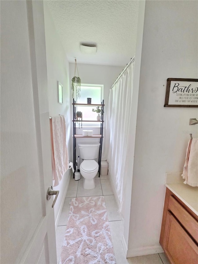 3897 NW 22nd Ave, Okeechobee, FL 34972 - full bath with toilet, tile patterned floors, baseboards, vanity, and a shower with curtain