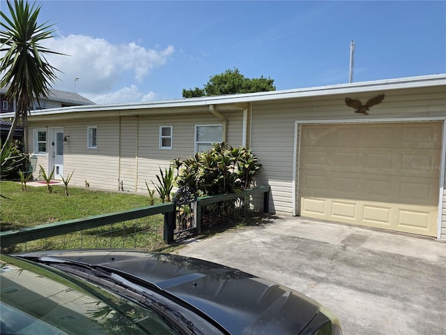 1209 5th St, Okeechobee, FL 34974 - view of front of house with a garage and driveway