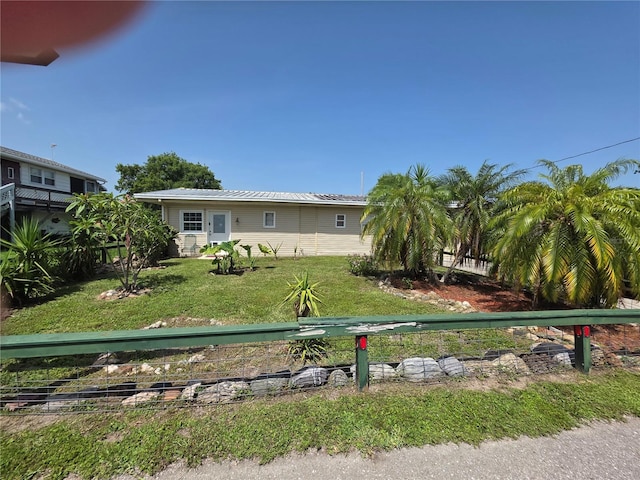 1209 5th St, Okeechobee, FL 34974 - view of front facade featuring a front lawn