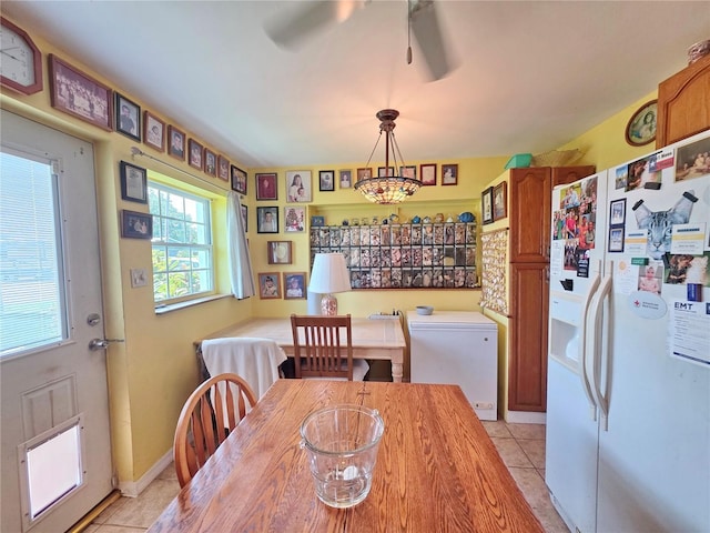 1209 5th St, Okeechobee, FL 34974 - dining room featuring light tile patterned floors and a ceiling fan