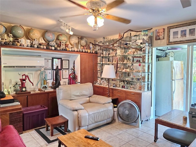 1209 5th St, Okeechobee, FL 34974 - living room featuring light tile patterned flooring, ceiling fan, and a wall unit AC