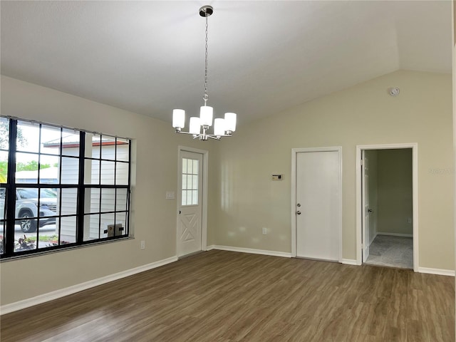 1150 SW 83rd Ave, Okeechobee, FL 34974 - unfurnished dining area with wood finished floors, a chandelier, and lofted ceiling
