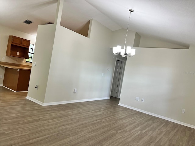 1150 SW 83rd Ave, Okeechobee, FL 34974 - unfurnished dining area with wood finished floors, a chandelier, and high vaulted ceiling