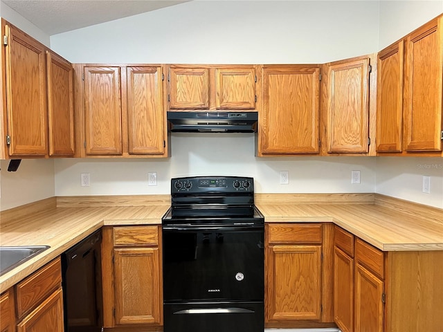 1150 SW 83rd Ave, Okeechobee, FL 34974 - kitchen featuring black appliances, under cabinet range hood, light countertops, lofted ceiling, and brown cabinets