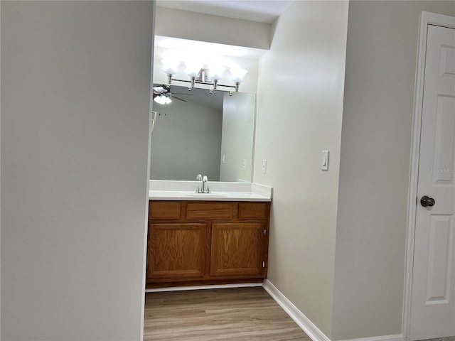 1150 SW 83rd Ave, Okeechobee, FL 34974 - bathroom with a ceiling fan, wood finished floors, and vanity