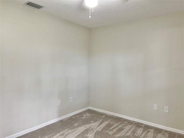 1150 SW 83rd Ave, Okeechobee, FL 34974 - unfurnished room with carpet, ceiling fan, and a textured ceiling