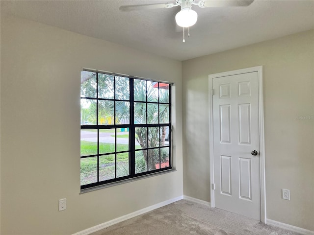 1150 SW 83rd Ave, Okeechobee, FL 34974 - empty room featuring a ceiling fan and carpet