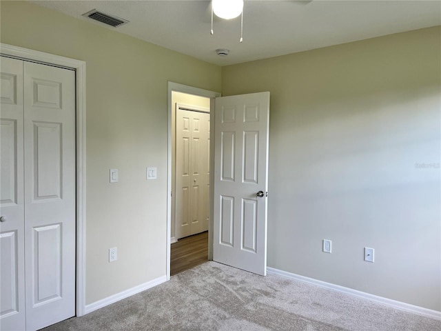 1150 SW 83rd Ave, Okeechobee, FL 34974 - unfurnished bedroom featuring light carpet and a ceiling fan