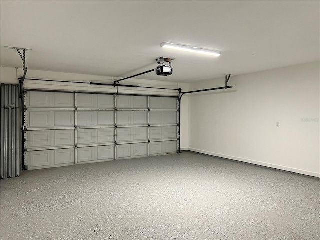 1150 SW 83rd Ave, Okeechobee, FL 34974 - garage featuring a garage door opener and baseboards