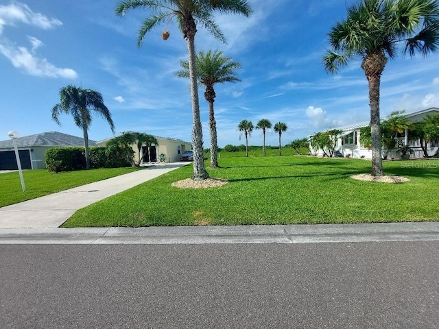 1000 SW 44th Blvd, Okeechobee, FL 34974 - view of home's community featuring a lawn and driveway