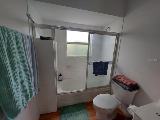1000 SW 44th Blvd, Okeechobee, FL 34974 - full bath featuring shower / bath combination with glass door, wood finished floors, and vanity
