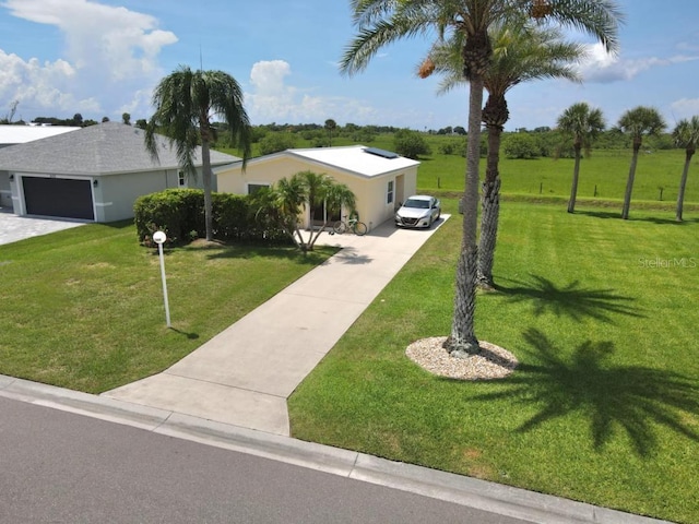 1000 SW 44th Blvd, Okeechobee, FL 34974 - ranch-style home with driveway, a front lawn, and stucco siding