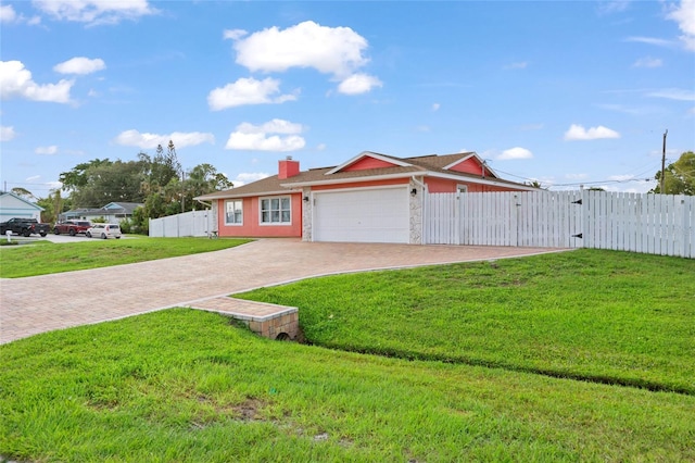402 SW Seaflower Ter, Port St Lucie, FL 34984 - ranch-style house featuring a gate, an attached garage, decorative driveway, and a chimney