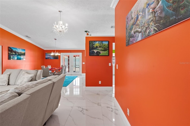 402 SW Seaflower Ter, Port St Lucie, FL 34984 - living room with a chandelier, light marble finish flooring, crown molding, french doors, and a textured ceiling