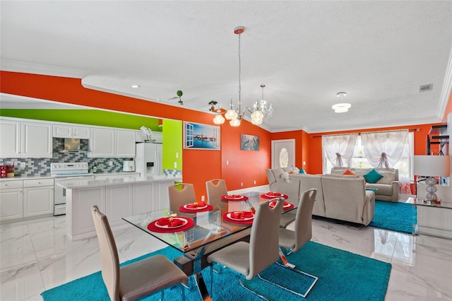 402 SW Seaflower Ter, Port St Lucie, FL 34984 - dining space with light marble finish floors, crown molding, a chandelier, and a textured ceiling