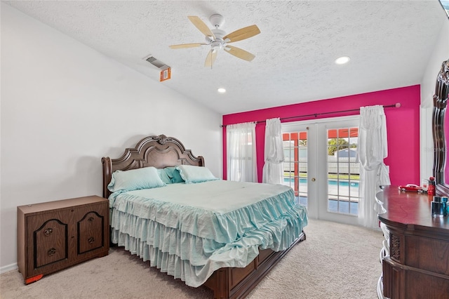 402 SW Seaflower Ter, Port St Lucie, FL 34984 - carpeted bedroom featuring a textured ceiling, access to outside, french doors, a ceiling fan, and recessed lighting