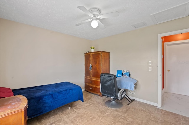 402 SW Seaflower Ter, Port St Lucie, FL 34984 - bedroom with a textured ceiling and ceiling fan