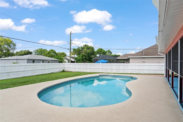 402 SW Seaflower Ter, Port St Lucie, FL 34984 - view of swimming pool with a fenced backyard and a sunroom