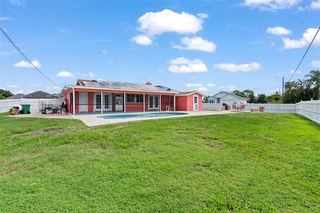 402 SW Seaflower Ter, Port St Lucie, FL 34984 - back of house featuring french doors, a patio, a fenced backyard, and a sunroom