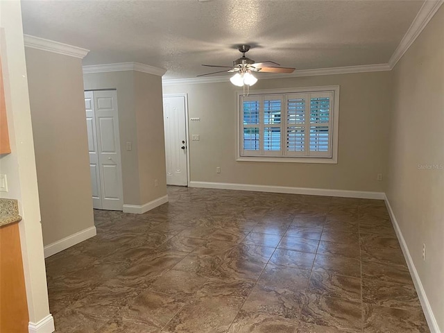 tiled empty room with ornamental molding, a textured ceiling, and ceiling fan