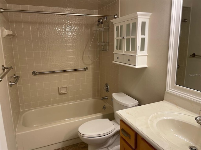 full bathroom with tiled shower / bath combo, large vanity, and toilet