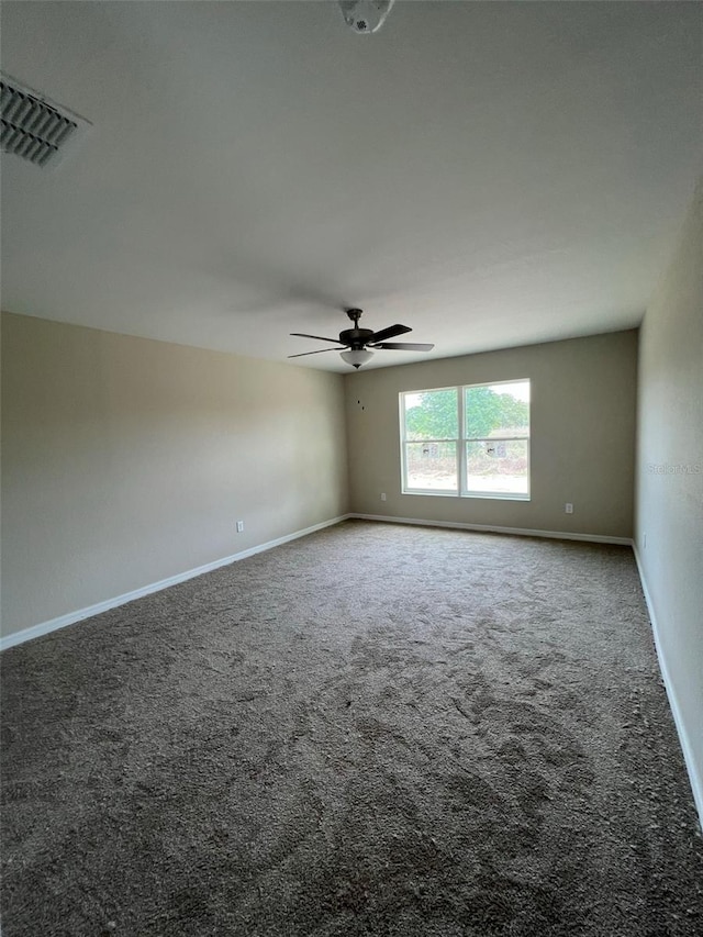 carpeted empty room with ceiling fan