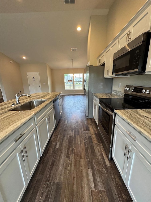 6711 SW 64th Ave, Ocala, FL 34476 - kitchen featuring stainless steel appliances, visible vents, a sink, dark wood-type flooring, and white cabinetry