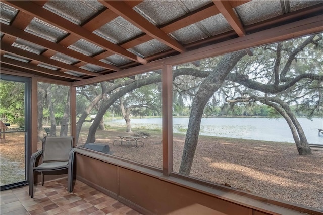 sunroom / solarium with a water view and coffered ceiling