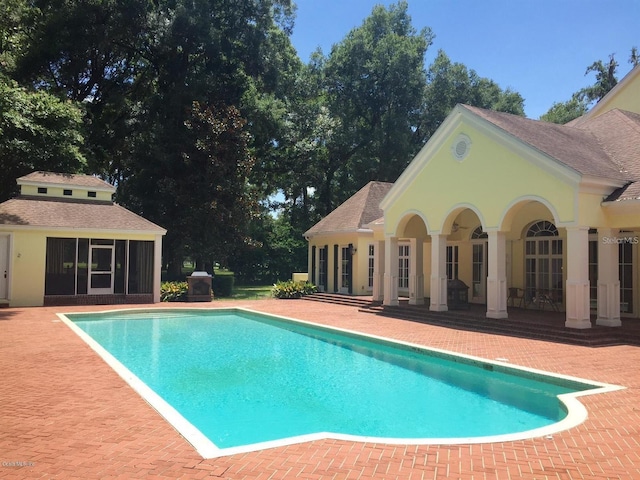 view of swimming pool with a patio