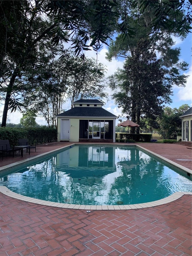 view of swimming pool featuring a patio area