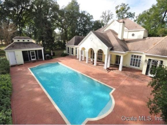 view of pool featuring a patio