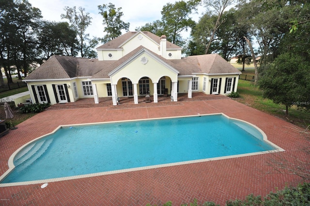 view of pool featuring a patio