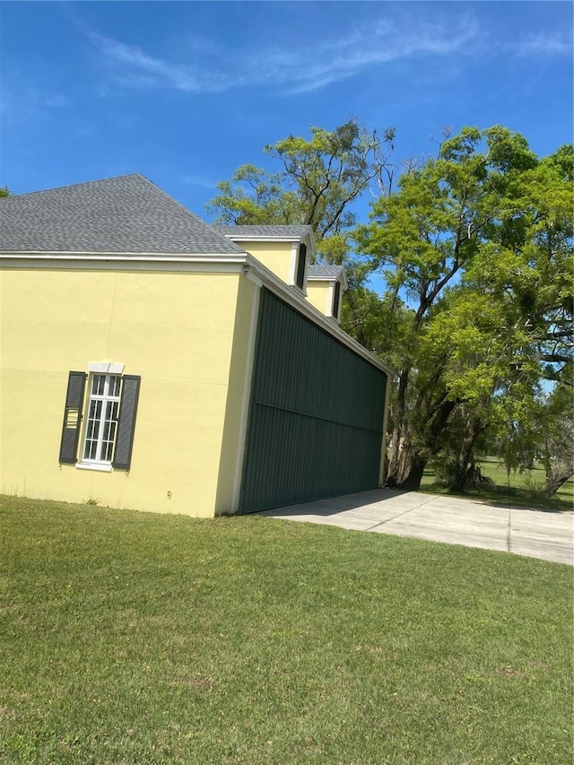 view of side of home featuring a yard