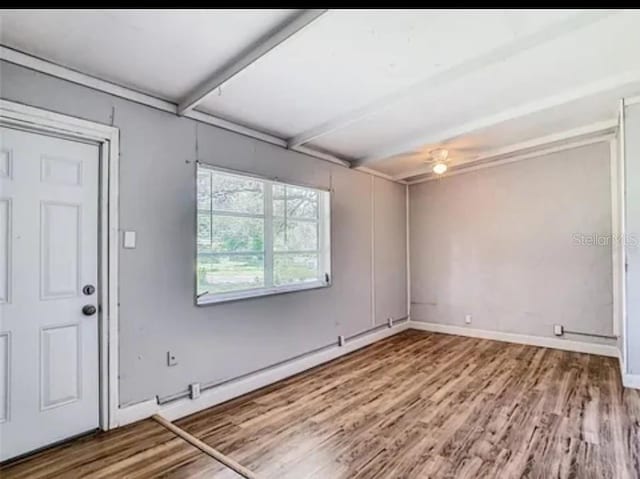 spare room featuring light hardwood / wood-style floors