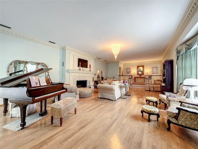 living room featuring crown molding and light wood-type flooring