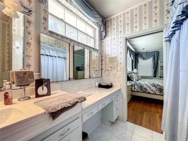 bathroom with tile floors and vanity