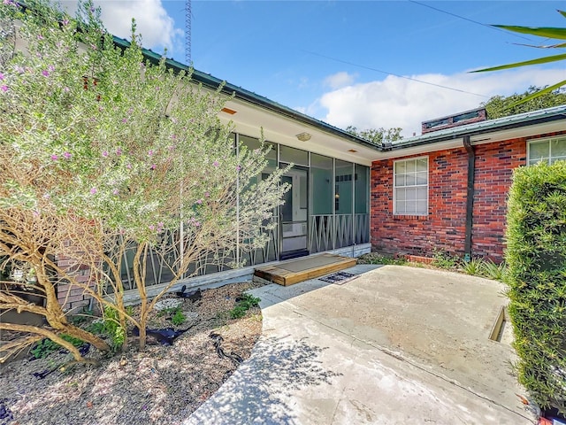 entrance to property with a patio area