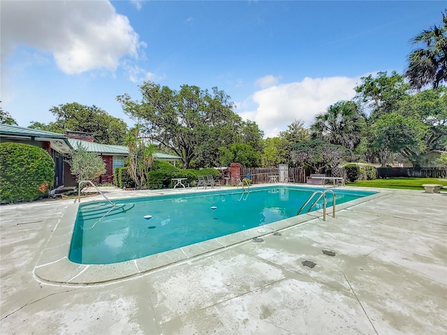 view of pool featuring a patio area