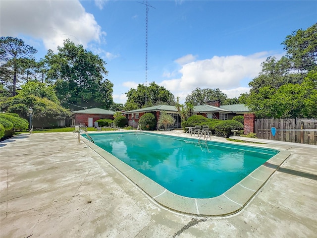 view of swimming pool featuring a patio