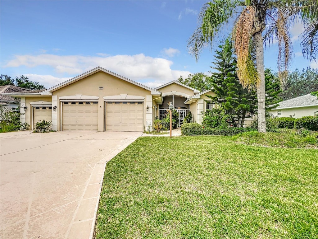 single story home with a garage and a front yard