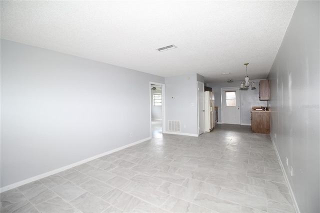 interior space with a textured ceiling