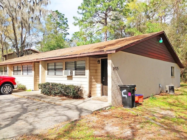 ranch-style home with central air condition unit